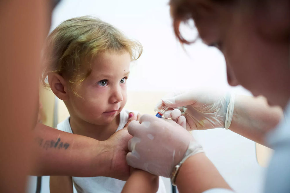 @UNICEF, Cybermedia, Child being vaccinated in the vaccination catch-up campaign from Buhusi-min